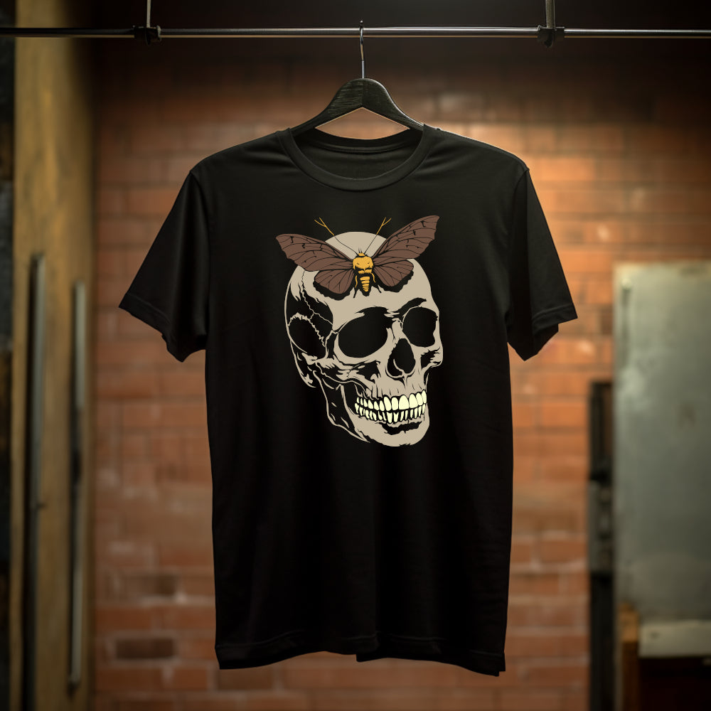 Black t-shirt with a brown moth on a large taupe skull with contrasting whitish teeth